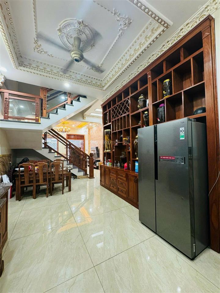 Nhà mặt tiền đường nguyễn văn trỗi  gần vòng xoay hiệp thành  1 trệt 2 lầu , 1 hầm xe hơi