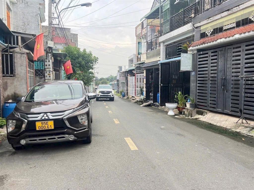 Bán nhà đường nhựa 8 m sân xe hơi trệt lầu gần trường học và chợ phường tân đông hiệp , dĩ an