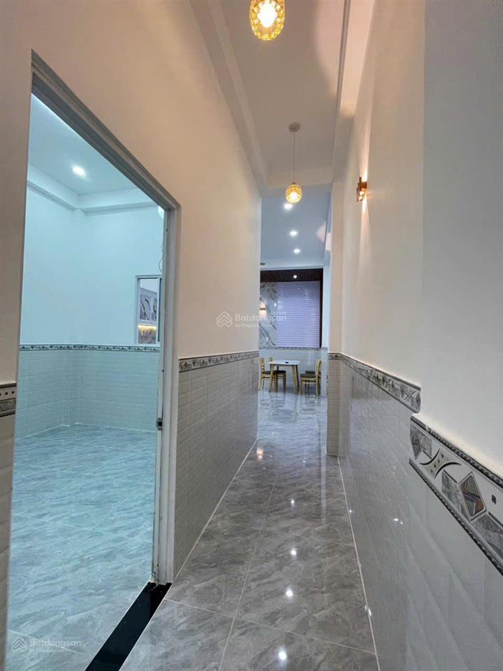 Bán nhà mới hoàng thiện sổ hồng riêng 1 trệt 1 lầu 3pn ,2toliet cách ngã ba tân kim 400 m