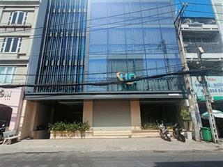 Cho thuê tòa nhà văn phòng ốp kính 12m x 20m hầm trệt 6 lầu trống suốt
