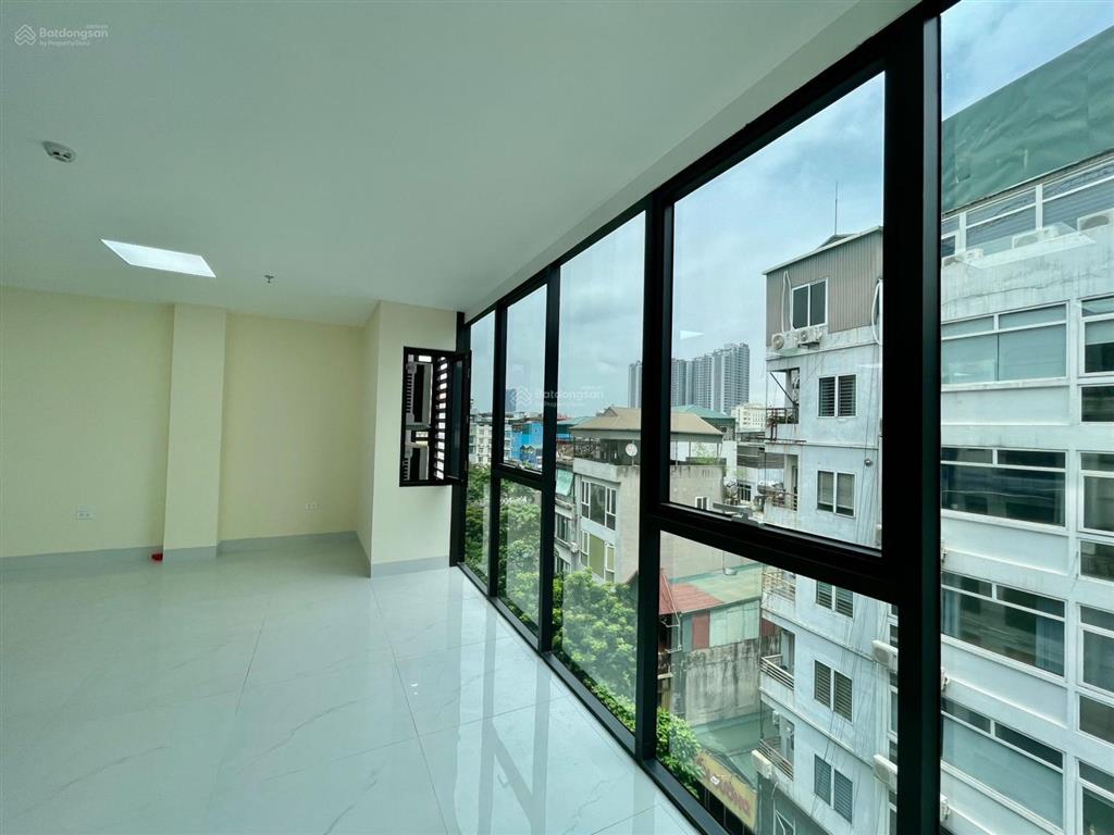 Cho thuê tòa nhà duy tân  trần thái tông 135m2 mt 6m 6t nổi 1 hầm thông sàn. giá 60 triệu/tháng