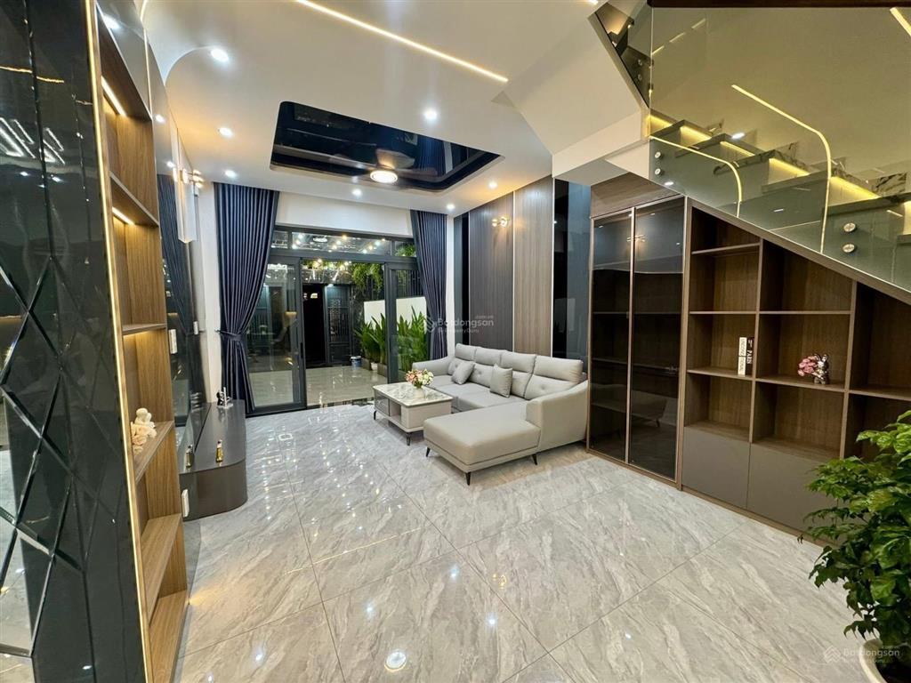 Nhà 3 lầu cao cấp sân xe hơi hẻm 12m gần cầu an lộc  giáp gò vấp. dt. 4.1m x 19.8m  80m2. giá tốt