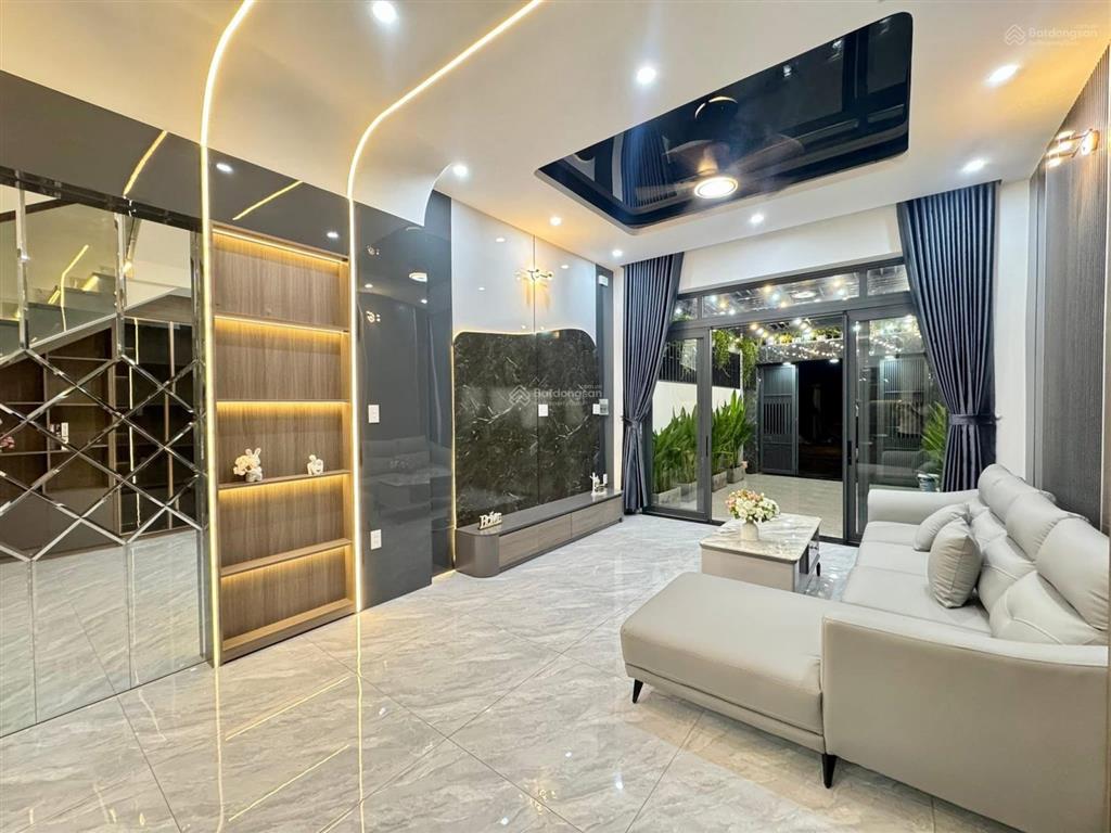 Nhà 3 lầu cao cấp sân xe hơi hẻm 12m gần cầu an lộc  giáp gò vấp. dt. 4.1m x 19.8m  80m2. giá tốt