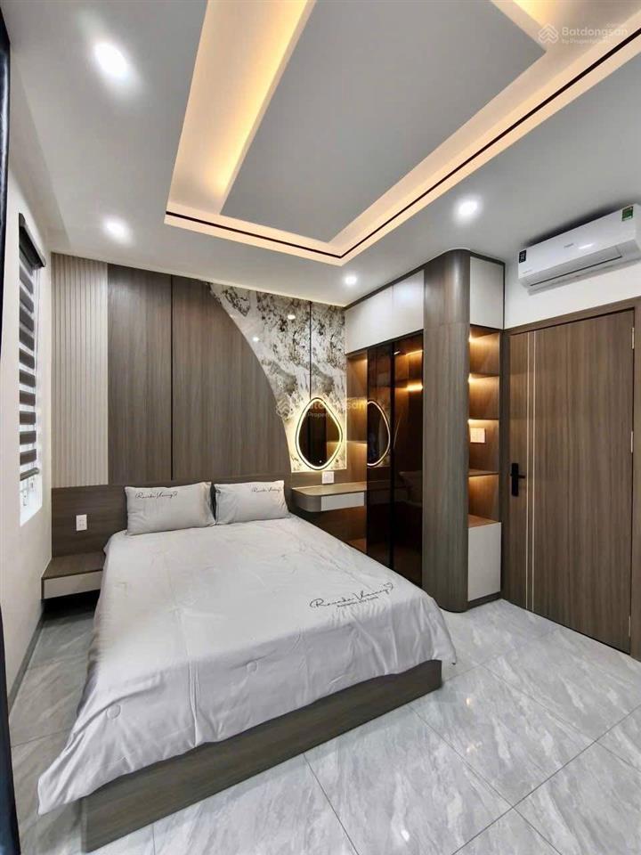 Nhà 3 lầu cao cấp sân xe hơi hẻm 12m gần cầu an lộc  giáp gò vấp. dt. 4.1m x 19.8m  80m2. giá tốt