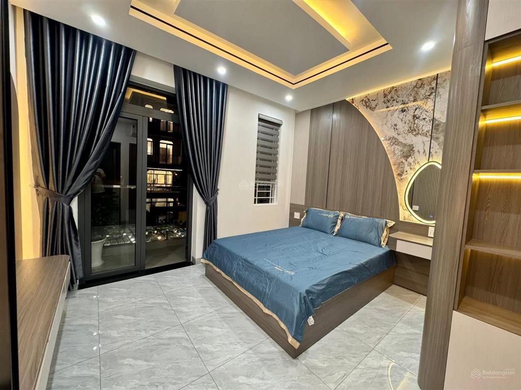Nhà 3 lầu cao cấp sân xe hơi hẻm 12m gần cầu an lộc  giáp gò vấp. dt. 4.1m x 19.8m  80m2. giá tốt