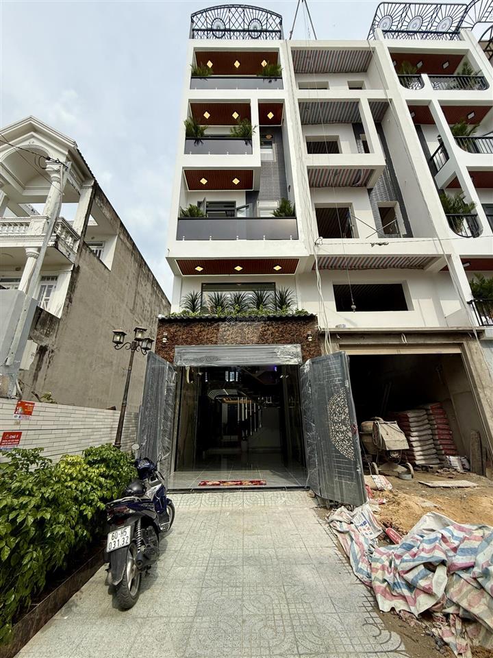 Nhà có thang máy đường thông dt 4x20m, lửng, 3 lầu, 4pn, gara ô tô, p. thờ, sân thượng, 7.9 tỷ