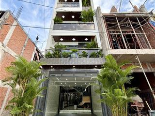 Nhà đường thông, ngay ngã tư ga, sát gò vấp, dt4x17,5m, lửng, 3lầu, 4pn, 6vs,gara ô tô, sân thượng