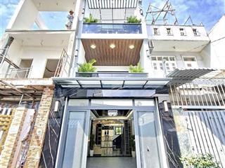 Bán nhà mới đẹp, 3 tầng  xe hơi đậu trong nhà. dt 4x 16m