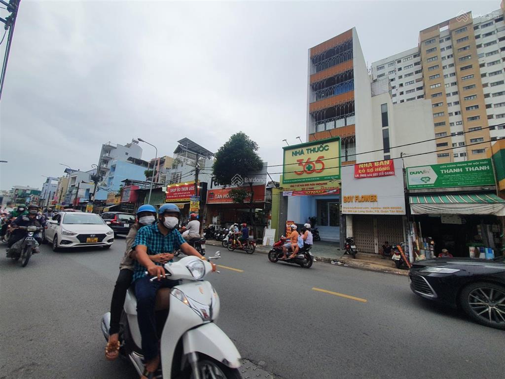 Nhà 2 mặt tiền trước sau 662 lạc long quân, dt 5m nở hậu l 12x22m, hầm 5 lầu tm, hđt 90 triệu/th