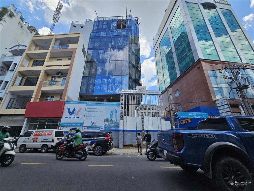 Tòa nhà góc 2mt 84 huỳnh văn bánh, phường 7, quận phú nhuận, diện tích 13,3x23m nở hậu 16,3m