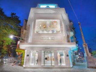 Tòa nhà góc 2 mt lê thánh tôn, quận 1. dt 8x20m. trệt 4 lầu thang máy