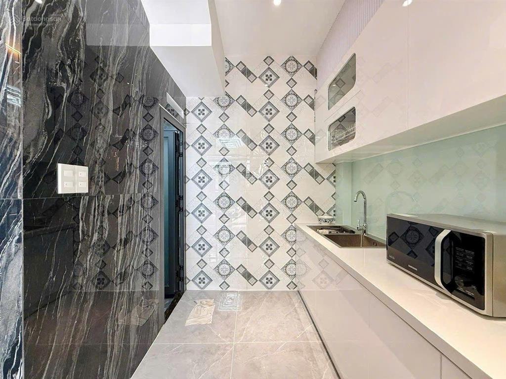 Nhà xây mới 3 lầu 32m2 hẻm xe hơi đường lê văn thọ, ngay công viên làng hoa.