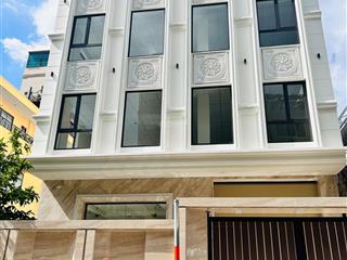 Tòa nhà khu bàu cát 10x20m hầm trệt 4 lầu có thang máy, cho thuê