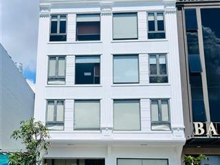 Tòa nhà mt đường đồng đen 12x20m hầm trệt 4 lầu cho thuê