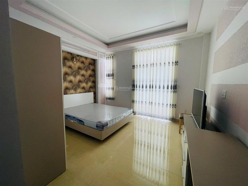 Bán nhà mặt tiền nguyễn văn đậu hầm 5 tầng, 8 phòng, thang máy, full nội thất,4.5x18m giá 22.9tỷ tl