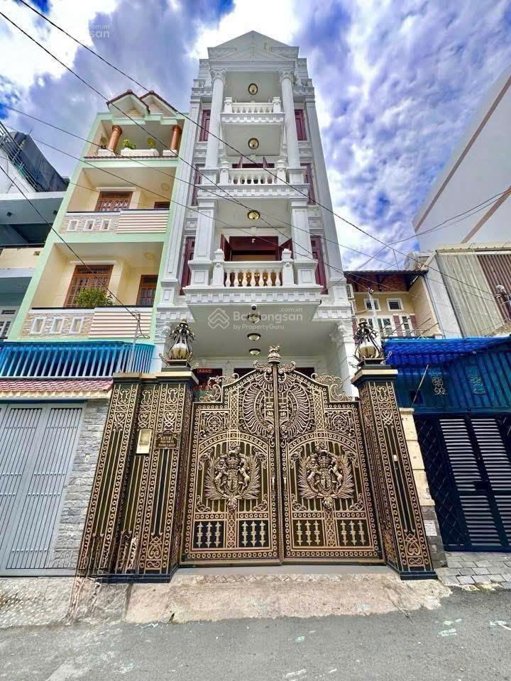 Bán nhà thang máy full nt gỗ quý 5x20m hầm 5 tầng đẹp  ngay siêu thị emart phan văn trị 16.5 tỷ