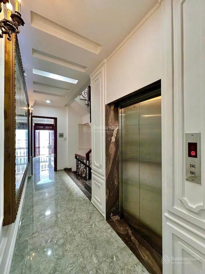 Bán nhà thang máy full nt gỗ quý 5x20m hầm 5 tầng đẹp  ngay siêu thị emart phan văn trị 16.5 tỷ