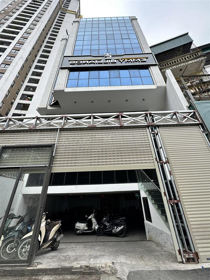 Tòa nhà văn phòng mới koong  9 tầng thang máy có hầm  ô tô tránh  2 mặt ngõ  gần ngã tư