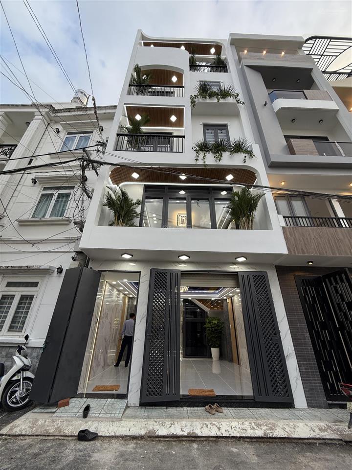 Nhà mới 5x15m trệt + lửng + 3 lầu, đường nhựa 8m thông. tặng full nội thất