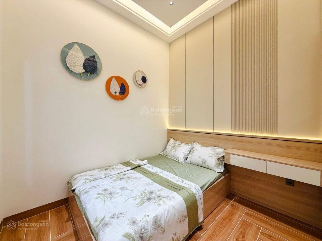 Nhà 4 tầng mặt tiền nguyễn duy cung,100m2,(4,3 x 24)4pn,4wc,sân thượng,có gara ô tô, chỉ có 11.99t