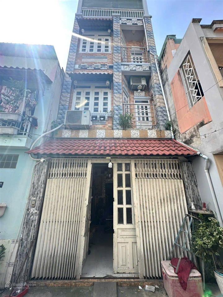 Phường tân hưng, quận 7, tp. hcm. 4 tầng cách hẻm xe hơi 15 mét. giấy tờ rõ ràng ngay trung tâm