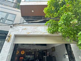 Nhà đẹp  giá tốt ở ngay đường 8m lê quang định (4.5x20m)  4 tầng cứng cáp, xe hơi đỗ trong nhà.