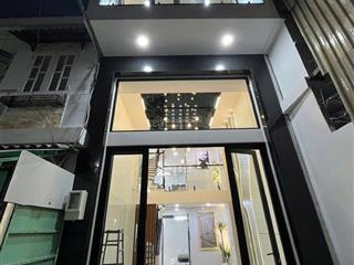 Nhà 4 tầng thang máy sịn sò tặng ntcc đường lạc long quân