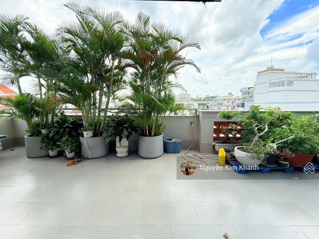 Hxh sát bên phan đăng lưu  103m2 6 tầng thang máy  ngang 9m  dt sàn 600m2  kts thiết kế riêng