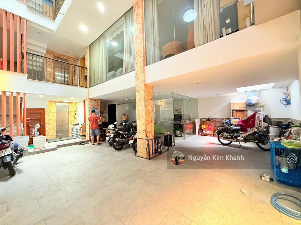 Hxh sát bên phan đăng lưu  103m2 6 tầng thang máy  ngang 9m  dt sàn 600m2  kts thiết kế riêng