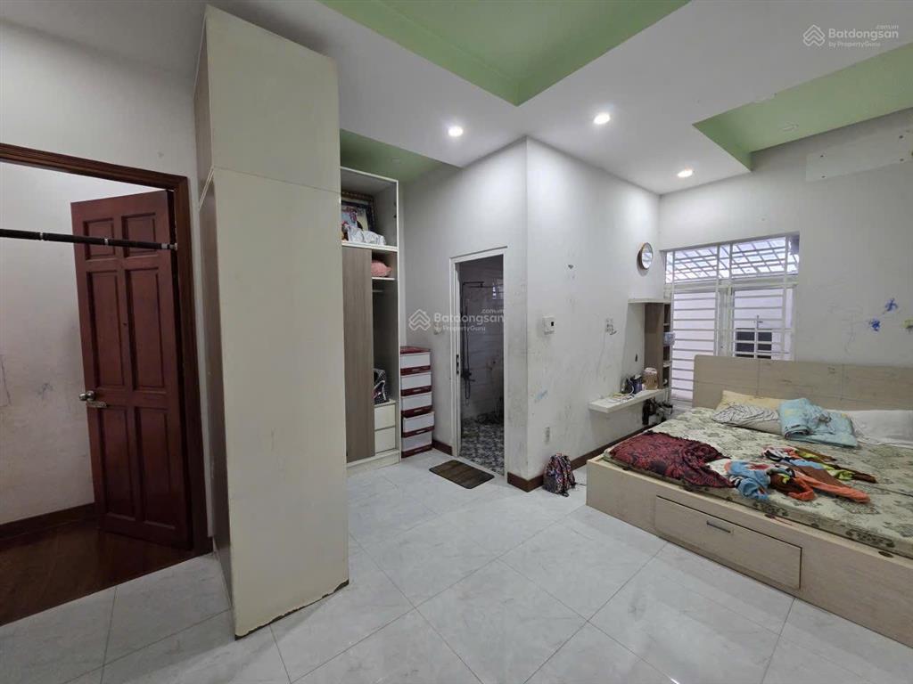 Bán căn nhà mt kinh doanh huỳnh văn luỹ  tp mới kế đường lê lợi , bình dương ( nay tp hcm )