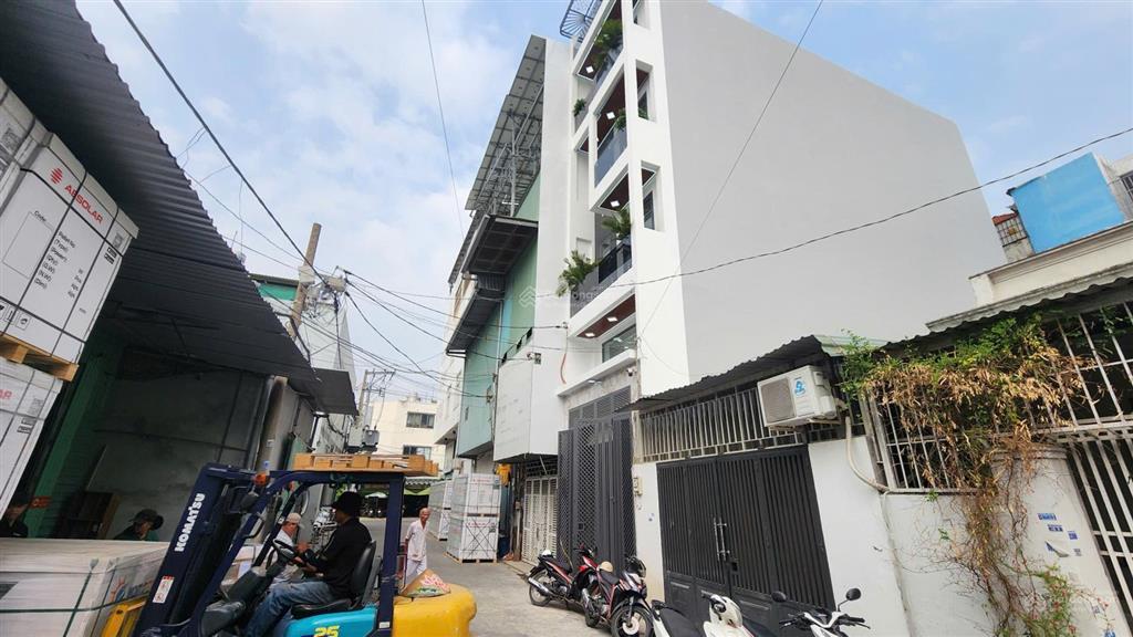 Bán nhà mặt tiền tch03  trung mỹ tây | thang máy  xây mới 100%