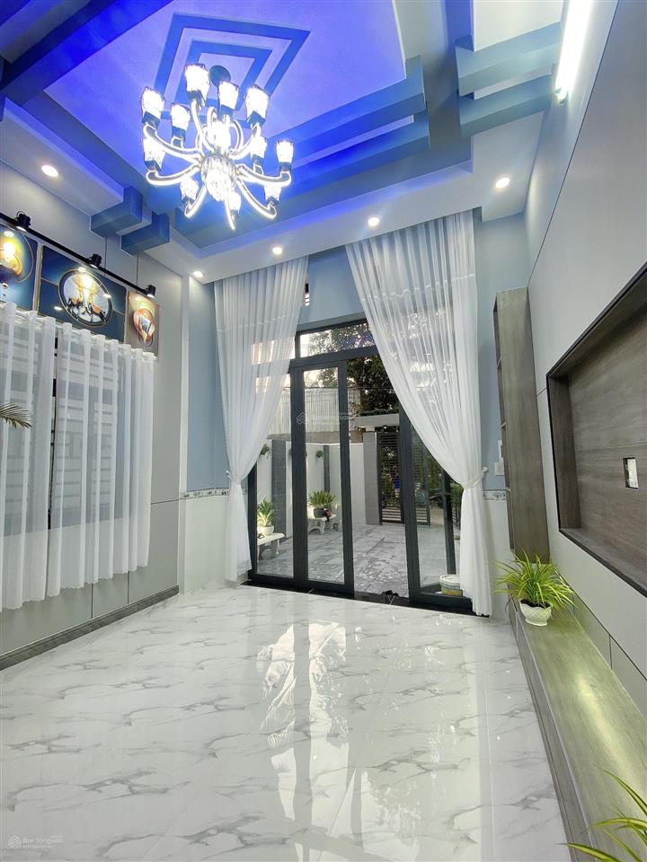 Bán nhà lầu mới hoàn thiện nhà có 4 p ngủ sân đậu được oto 7 chỗ nhà nhánh đ huỳnh thị nở