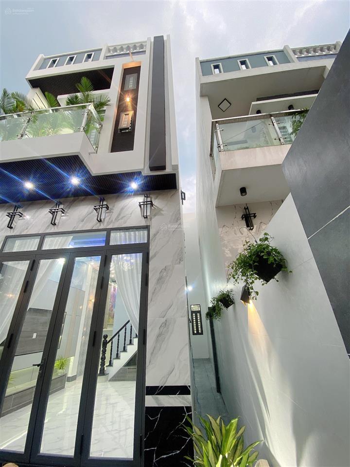 Bán nhà lầu mới hoàn thiện nhà có 4 p ngủ sân đậu được oto 7 chỗ nhà nhánh đ huỳnh thị nở