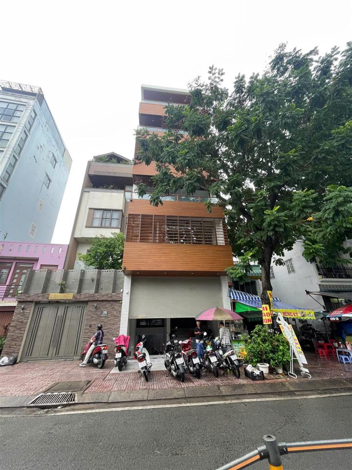 Cho thuê nhà nguyên căn mt đường a4, khu k300. dt 5x20m. 1 trệt 5 lầu. thang máy. thiết kế vp