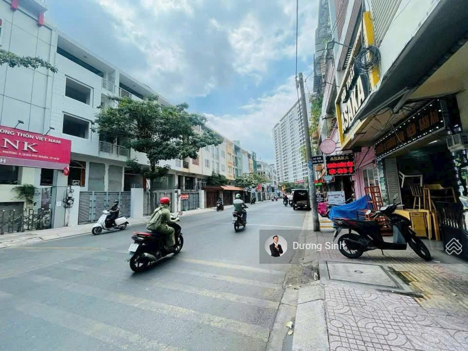 Nhà nguyên căn mặt tiền đường phổ quang. dt 8x20m. 1 hầm, 4 lầu. có thang máy