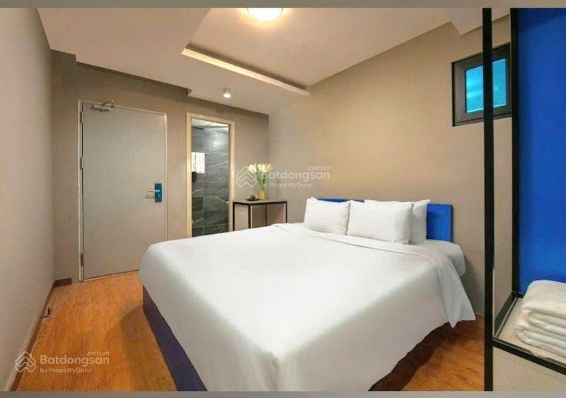 Cần thanh khoản gấp tòa nhà lô góc trần quốc vượng dt131m2 xd8 tầng thang máy dòng tiền 1.8tỷ/nắm