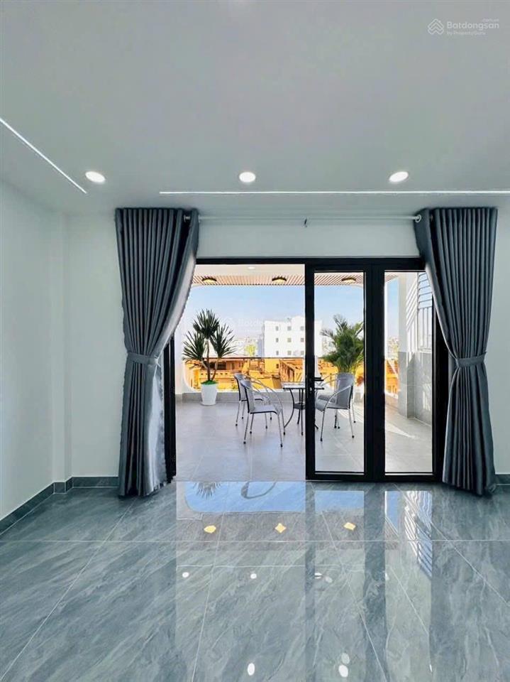 Nhà mặt tiền kinh doanh + thang máy cao cấp đường 12m. dt 5m x 17m 1 lửng 3 lầu gần hà huy giáp