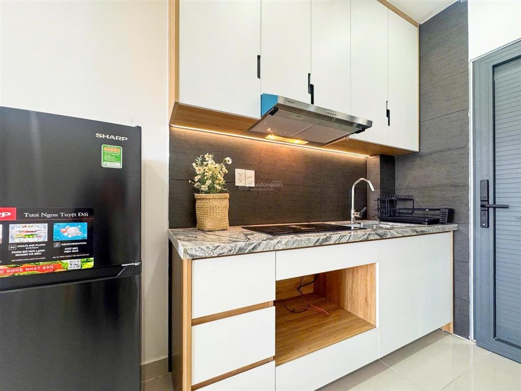 Căn hộ 35m2 máy giặt riêng, full nội thất  ban công cửa sổ lớn ngay cầu tham lương