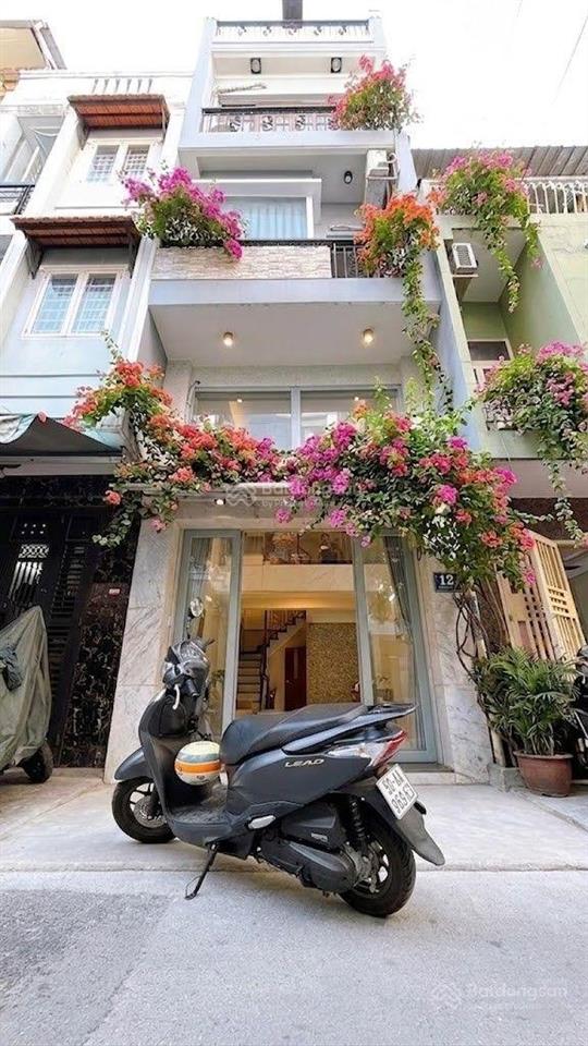 Mua bán nhà quận 4, đường số xe hơi, 5 tầng hoàn công, sát q1 thông vĩnh hội.