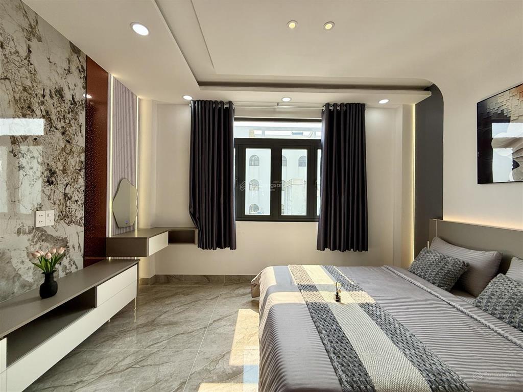 Nhà mặt tiền đường thông tx 38, dt4.2x14m, lửng, 3 lầu, 4pn, p. thờ, gara xe, sân thượng, 6,4 ty