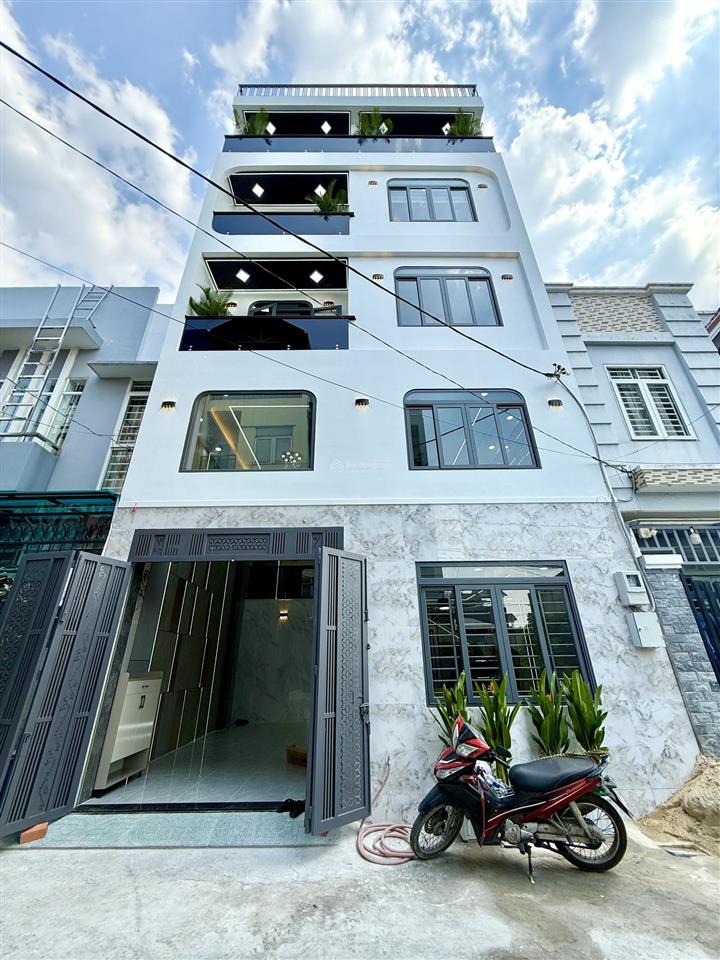 Nhà có thang máy, sát bên công viên, dt7x9m, lửng, 3 lầu, 4pn, gara ô tô, sân thượng, 7.6 tỷ