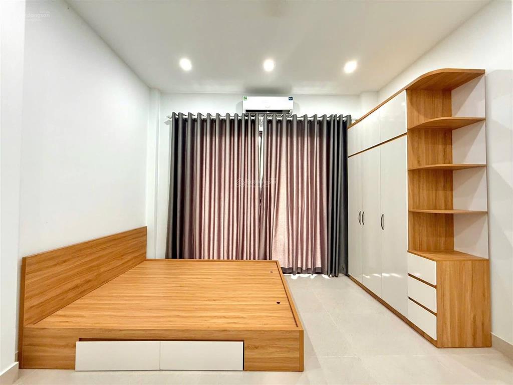 Bán tòa nhà căn hộ dòng tiền phố trần đại nghĩa  gần neu, lô góc 90m2, 7t thang máy, đủ gpxd pccc