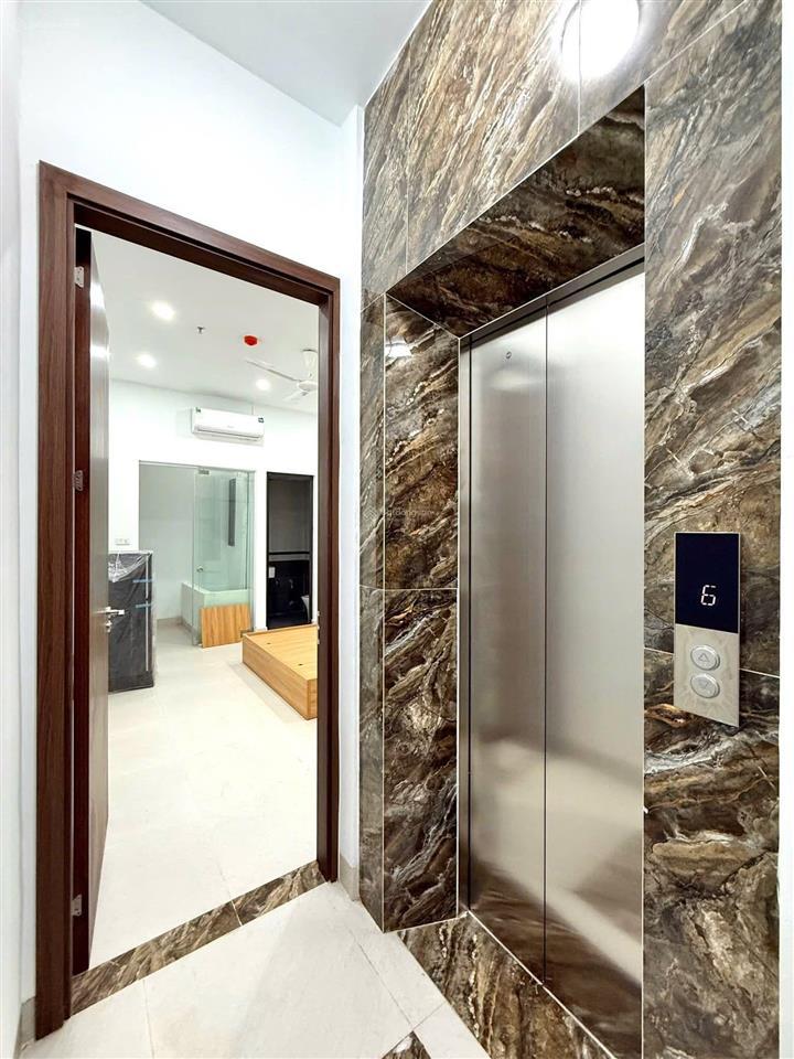 Bán tòa nhà căn hộ dòng tiền phố trần đại nghĩa  gần neu, lô góc 90m2, 7t thang máy, đủ gpxd pccc