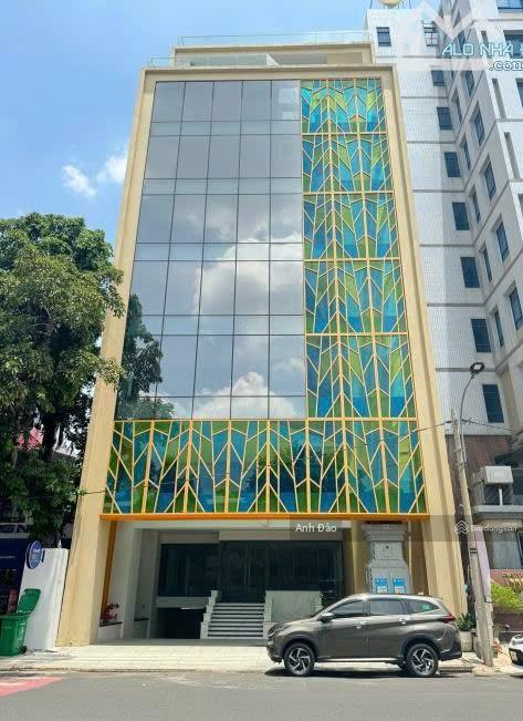 Cho thuê tòa nhà mới xây trục sân bay  mặt tiền trần quốc hoàn, tân bình