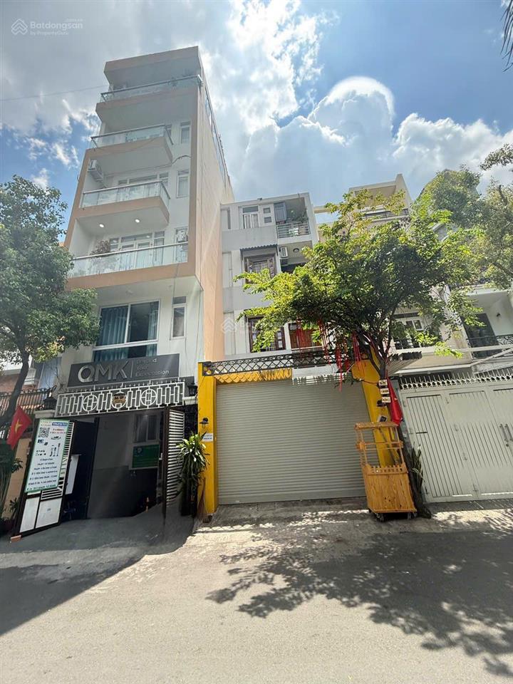 Tòa nhà văn phòng tại hẻm 8m thông phổ quang  gần sân bay tsn. 5x20, 8 tầng + hầm + thang máy.