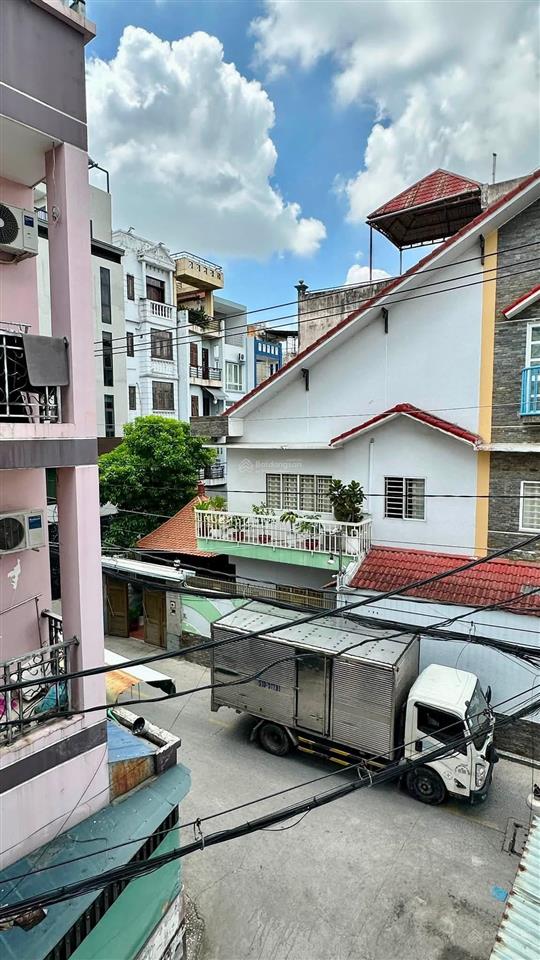 Bán nhà 4 tầng  5 phòng ngủ  ô tô ngủ trong nhà ngay chợ lạc quan
