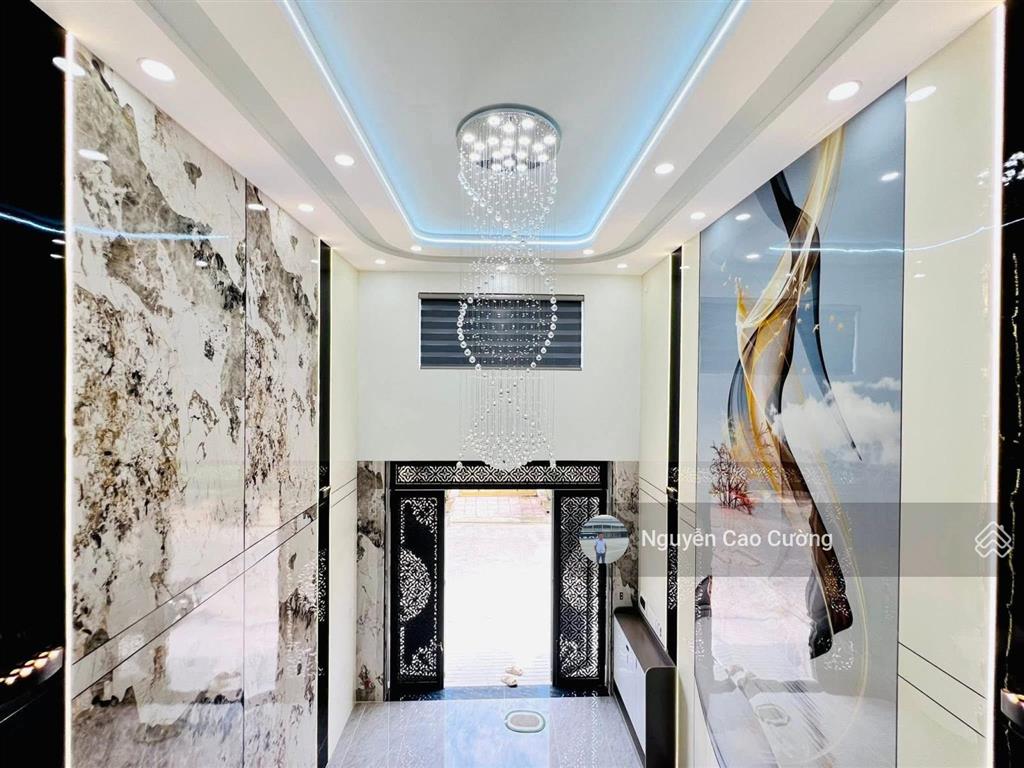 Bán nhà thang máy 4x16m 1lững 3 lầu đường 8m thông trung mỹ tây 2a