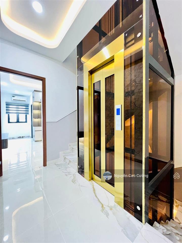 Bán nhà thang máy 4x16m 1lững 3 lầu đường 8m thông trung mỹ tây 2a