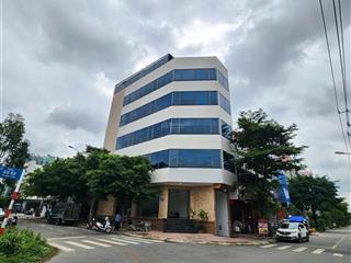 Tòa nhà văn phòng, góc 2 mặt tiền, 5 tầng hoàn công, có hầm + thang máy, kdc sau lưng bigc go dĩ an
