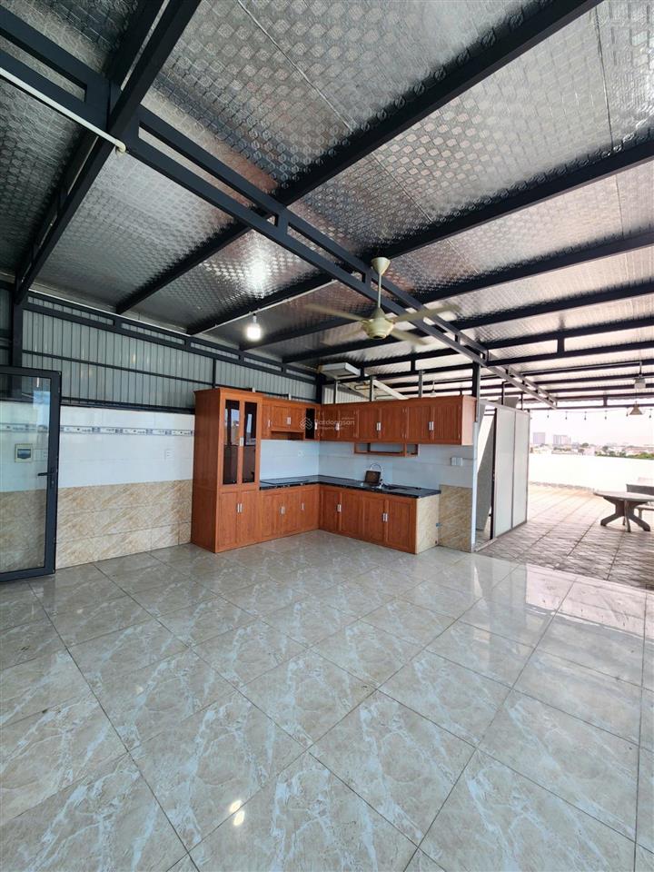 Tòa nhà văn phòng, góc 2 mặt tiền, 5 tầng hoàn công, có hầm + thang máy, kdc sau lưng bigc go dĩ an
